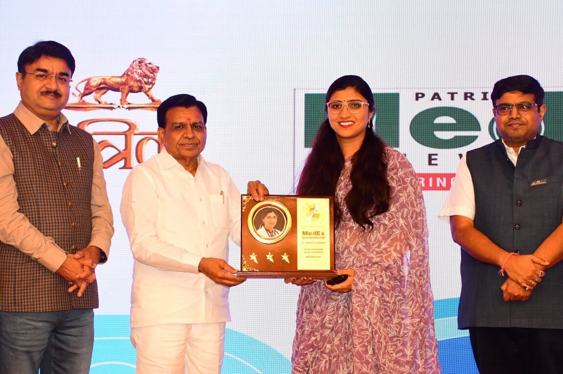Dr. Harshita Sharma receiving a prestigious medical excellence award in Bhopal.
